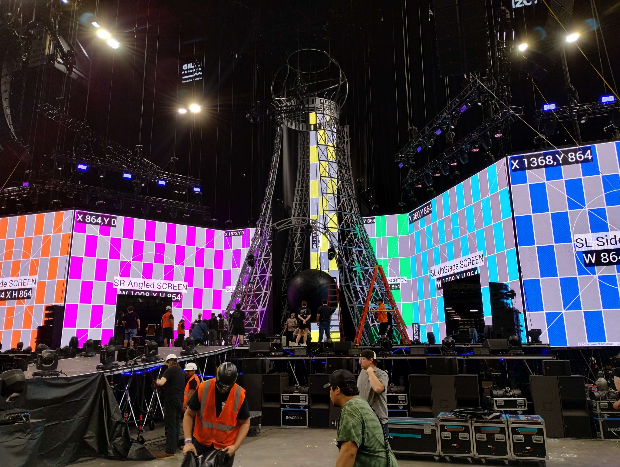 Multi-panel LED video wall displaying test patterns during concert production setup