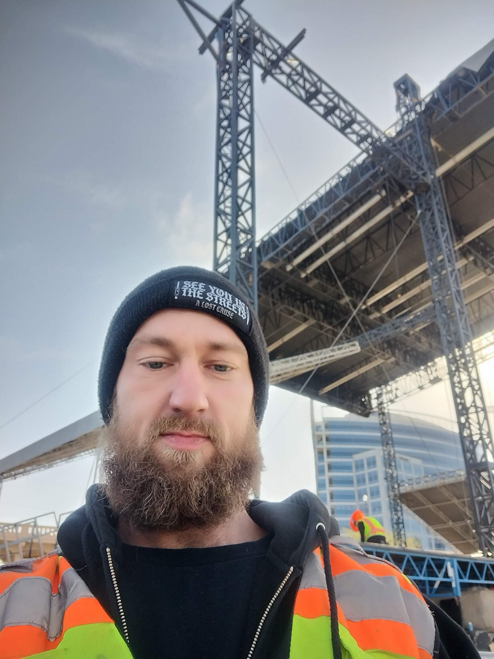 Aaron Bowman in front of outdoor stage truss structure at Innings Festival 2026 at Tempe Town Lake